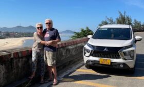 Travelers moving from Hue to Phong Nha by bus and car through scenic Central Vietnam countryside and limestone landscapes.