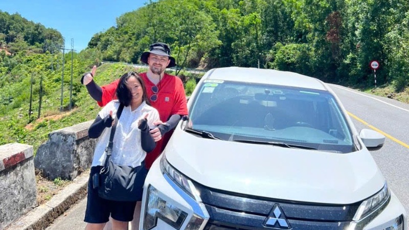 Scenic one-day road trip from Hue to Hoi An featuring mountain passes, coastal landscapes, Lap An Lagoon, Lang Co Beach, and the historic streets of Hoi An Ancient Town.