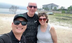 Private car with driver traveling through Hue, Vietnam, offering comfortable transport to the Imperial City, royal tombs, and scenic countryside.