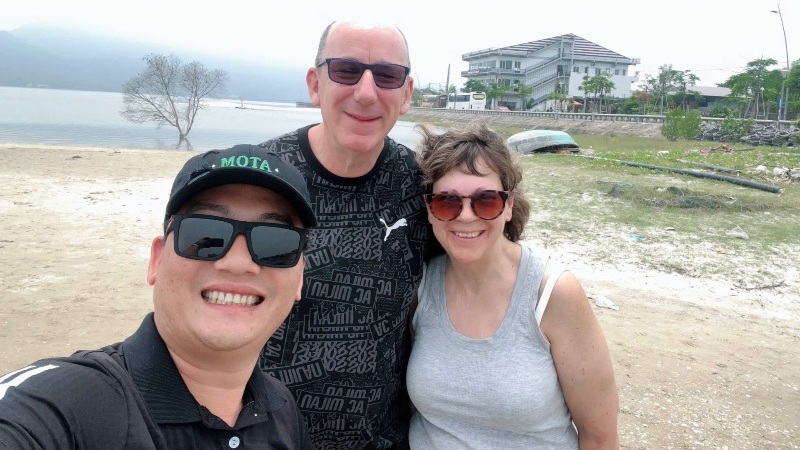 Private car with driver traveling through Hue, Vietnam, offering comfortable transport to the Imperial City, royal tombs, and scenic countryside.